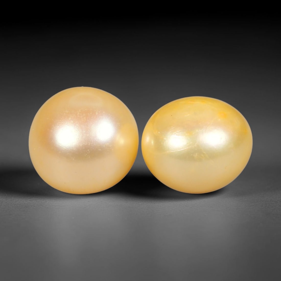 10.08ct Natural Warm Golden Yellow Orient Freshwater Half Round Pearl Pair, 52XZ: Matching pair of color-enhanced freshwater half-round pearls measuring 9.8x7.9mm each, crafted with smooth domed silhouettes ideal for earring mounting. The pearls feature a rich saturated warm golden