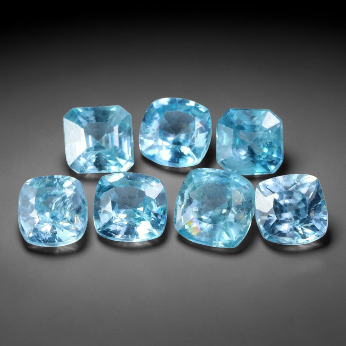 6.32ct Natural Blue Zircon Cushion Faceted Parcel Loose Gemstone, 21WW: Matching parcel of hand faceted natural blue zircon gemstones showcasing bright tranquil blue body hue with subtle inherent mineral traits within each stone. Precision faceting and sleek high polish m