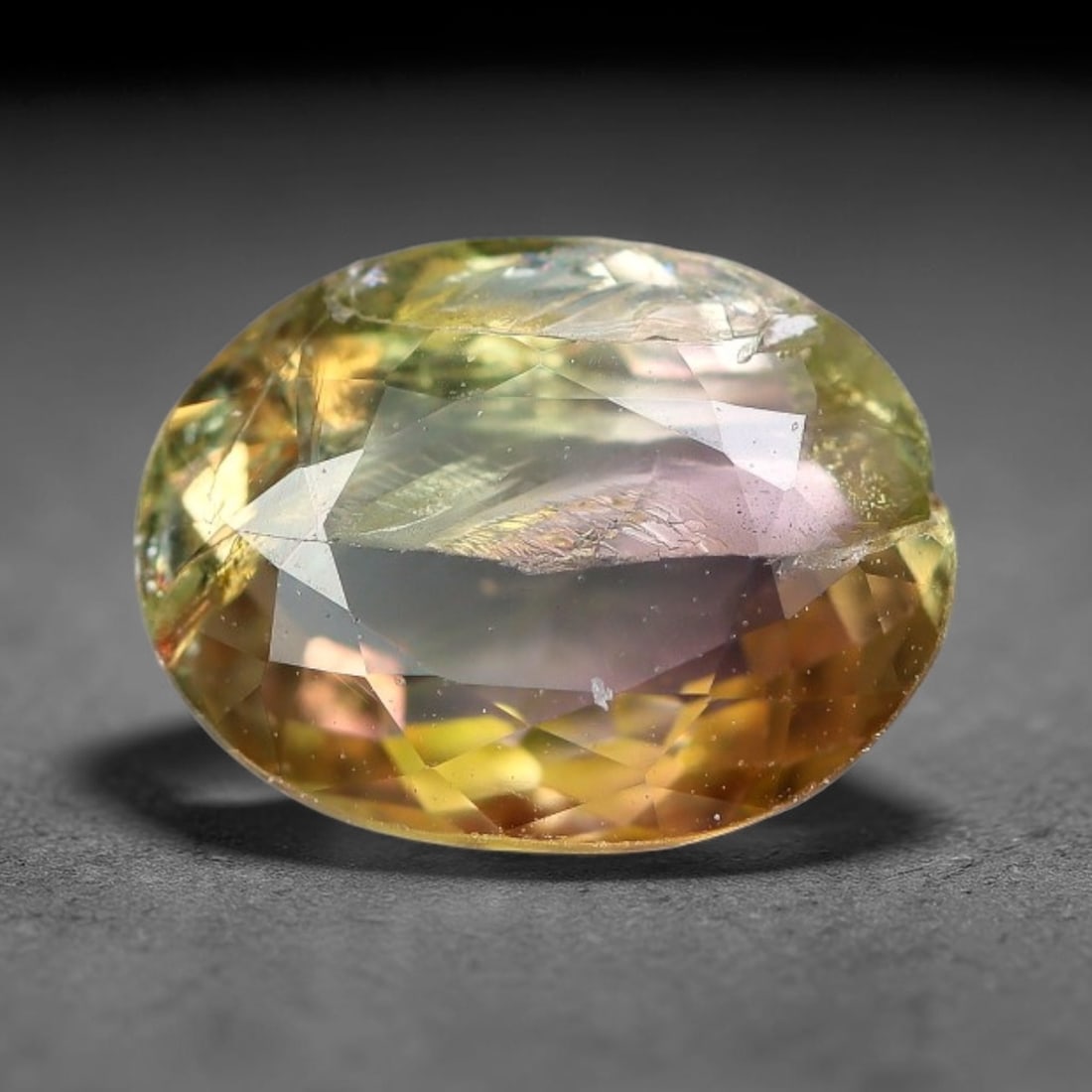 1.37 Carats Natural Bi-Color Yellow Pink Oval Faceted Tourmaline Loose Gemstone, 98YG: Natural dual-toned yellow and blush pink tourmaline expertly oval faceted loose gemstone, brilliant multi-facet cut amplifies light refraction and showcases striking horizontal color zoning: warm hone