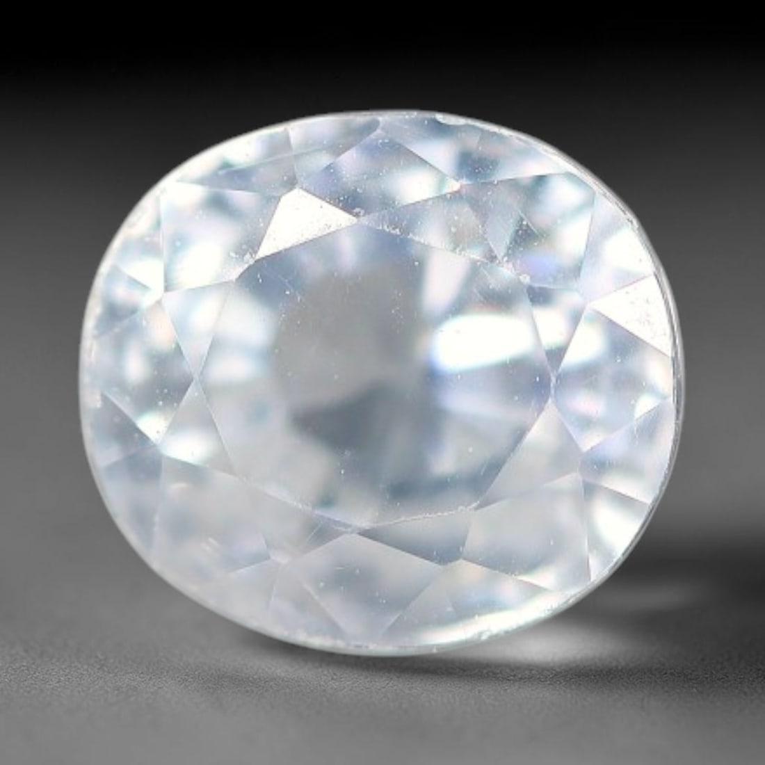 2.64ct Natural White Topaz Oval Faceted Gemstone, 86WW: Expertly faceted natural white topaz with excellent clarity and brilliant light reflection across precisely cut facets. The stone carries a clean colourless body tone, showcasing inherent natural subt