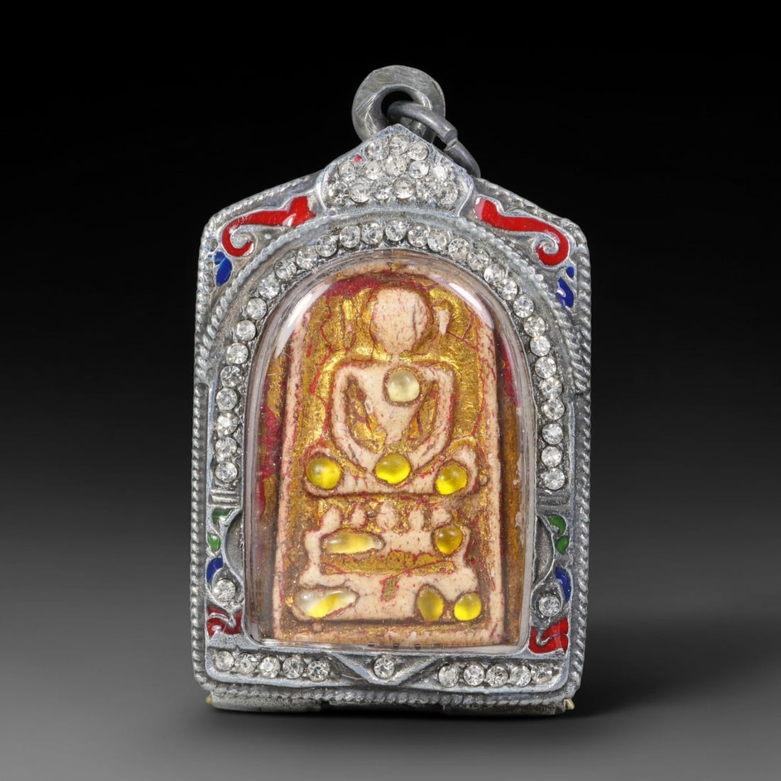 Thai Gilded Clay Metal Amulet Buddhist Votive Pendant, 26ZB: Formed from fired clay with applied gilded surface layers, the piece uses traditional molding techniques characteristic of Southeast Asian devotional craft. The construction adheres to standard region