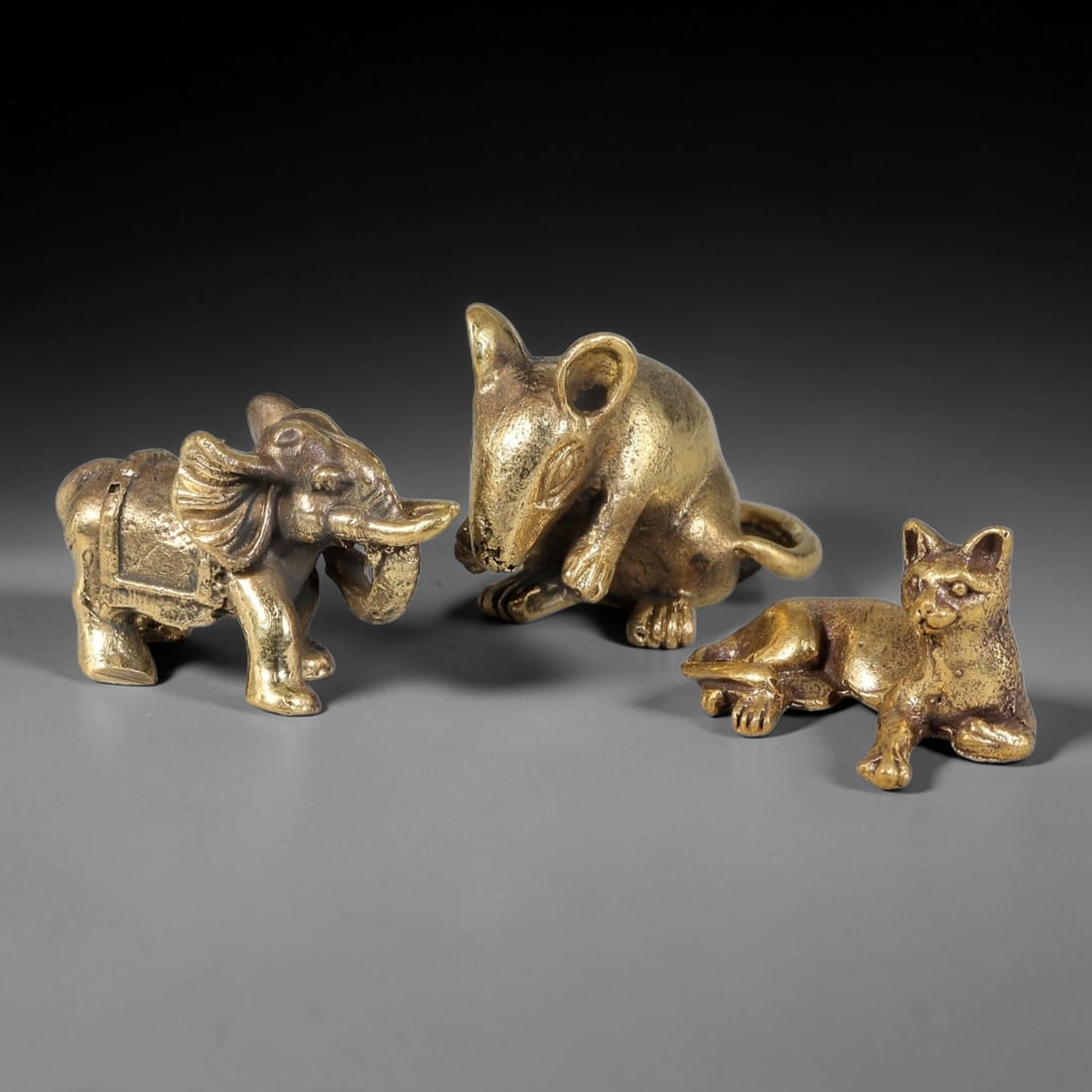 Thai Vintage Copper Alloy Sacred Animal Devotional Figures - 3pcs Set, 96YY: Mini vintage copper alloy sacred animal statuette set with three pieces, each sized 4.5x2.0cm. This collection consists of finely detailed carved elephant, rat and reclining cat figurines with antique