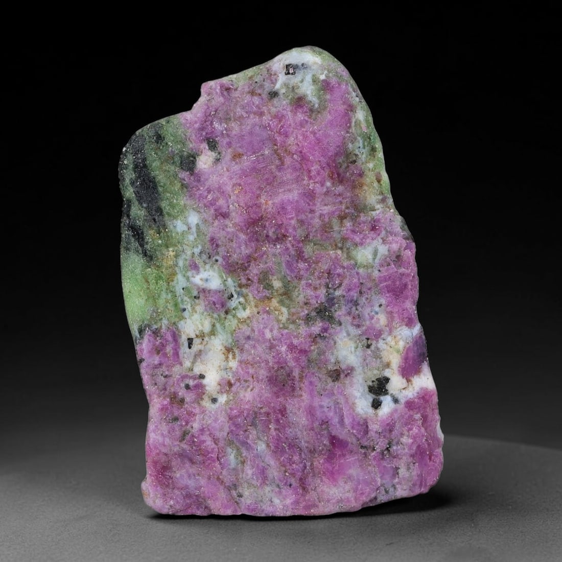 86ct Natural Tanzanian Ruby Zoisite Raw Rough Specimen Mineral Stone, 97YK: This unpolished mineral rough is natural ruby zoisite sourced from Tanzania, exhibiting distinct banded mineral segregation of vibrant green zoisite, magenta ruby crystals, and dark hornblende inclusi