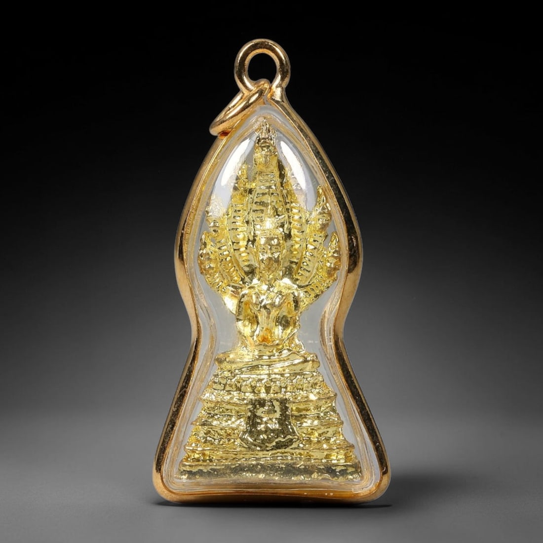 Thai Gold Plated Naga Covered Buddha Amulet Pendant With Clear Protective Casing, 66YY: Unique hourglass shaped gold plated frame amulet measuring 4.5x2.3cm, fitted with dual gold jump rings for necklace wear. Sealed transparent clear cover protects the intricate golden seated Buddha min