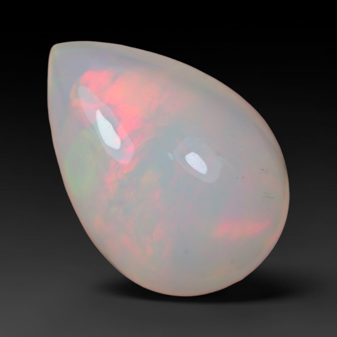 3.95 Carats Natural Ethiopian Welo Opal Oval Cabochon Loose Gemstone, 35XV: Natural Ethiopian Welo opal polished oval cabochon loose gemstone, luminous translucent milky white base stone with vivid multi-hued play-of-color featuring bright emerald green, lime yellow, soft blu