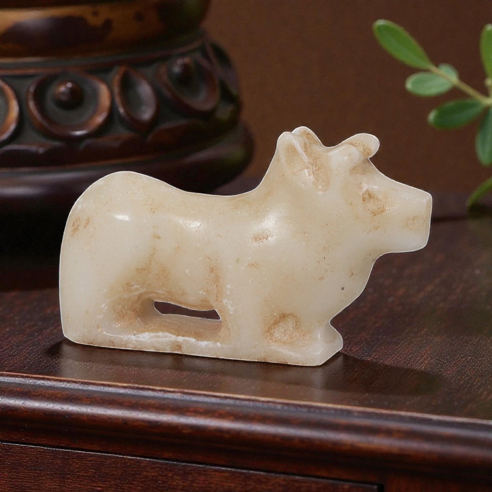 Ancient Bactrian Zoomorphic Marble Amulet, Circa 3rd-2nd Millennium BCE, 89YD: This ancient zoomorphic amulet is carved from pale, creamy marble, depicting a stylized standing bovine figure in profile. The form features simplified anatomical details including the head with incis