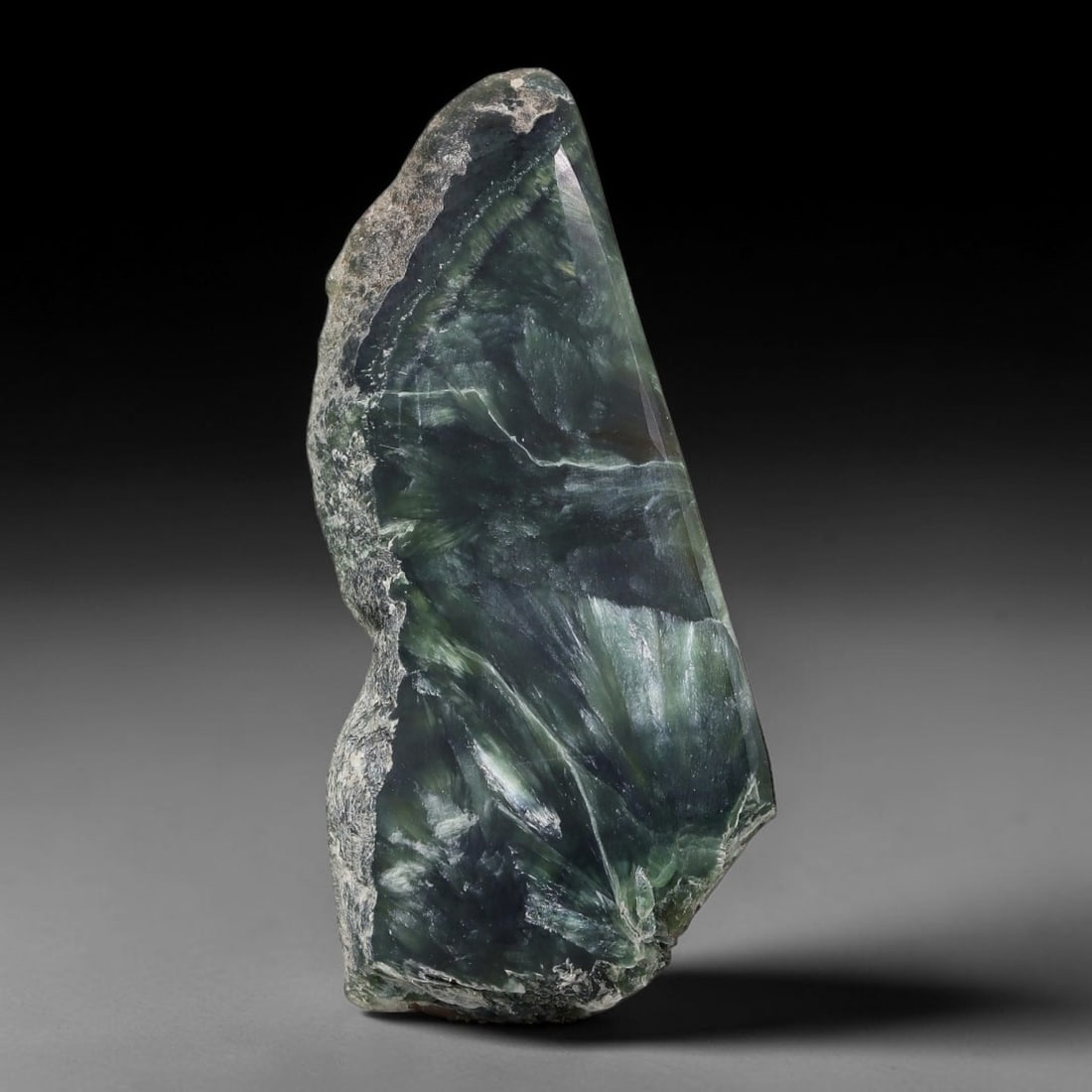 46ct Natural Siberian Seraphinite Polished Rough Slab, 14WV: This polished mineral slab is natural seraphinite originating from Siberian deposits, displaying characteristic radiating crystalline fibrous formations with layered deep forest and silvery green band