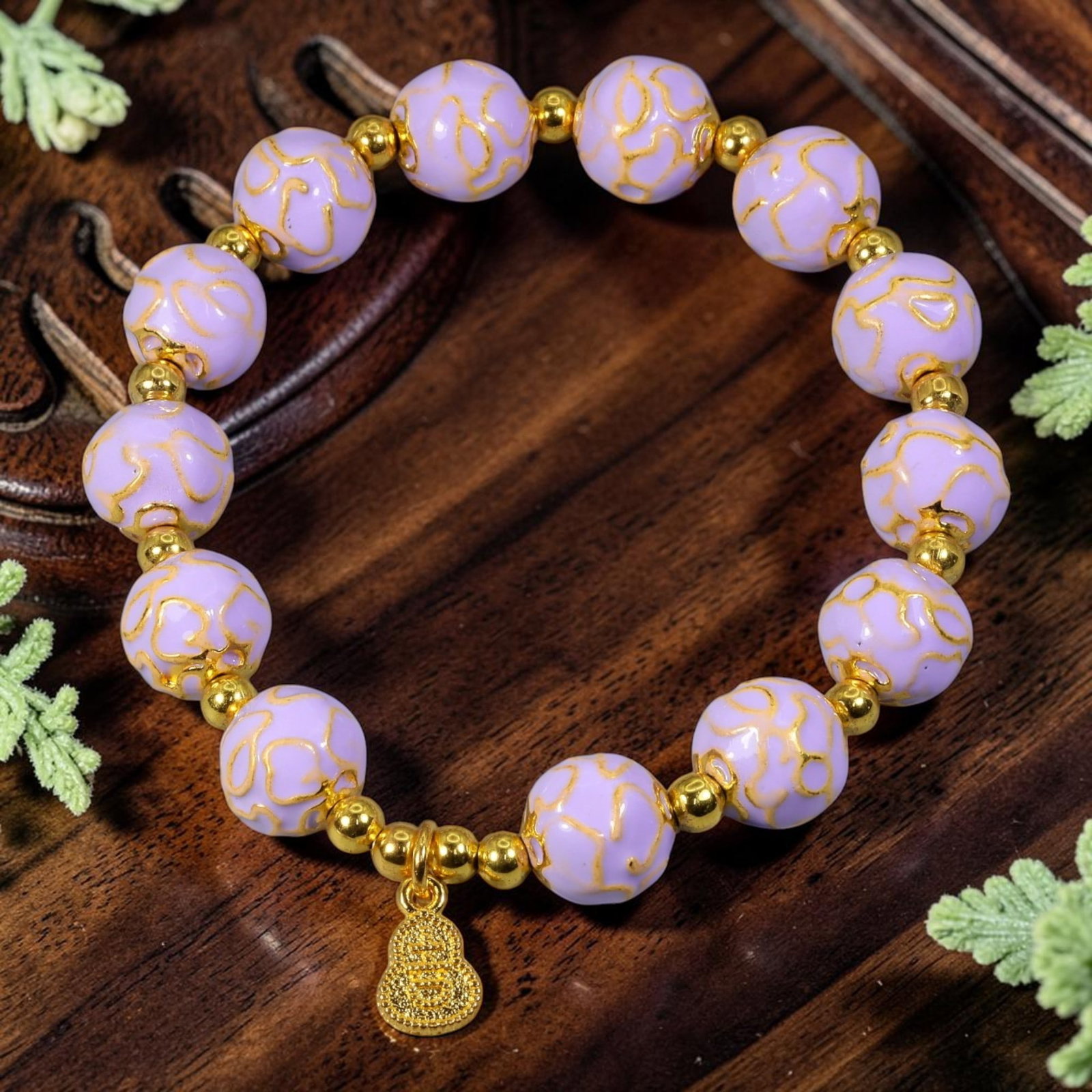 Chinese Cloisonne Enamel Beaded Bracelet - Lavender Large Bead Gold Gourd Longevity Charm, 59YG: This modern Chinese revival stretch bracelet features large round cloisonne enamel beads measuring 10.00 millimeters, finished in soft pastel lavender enamel covered with delicate raised gold-tone swi