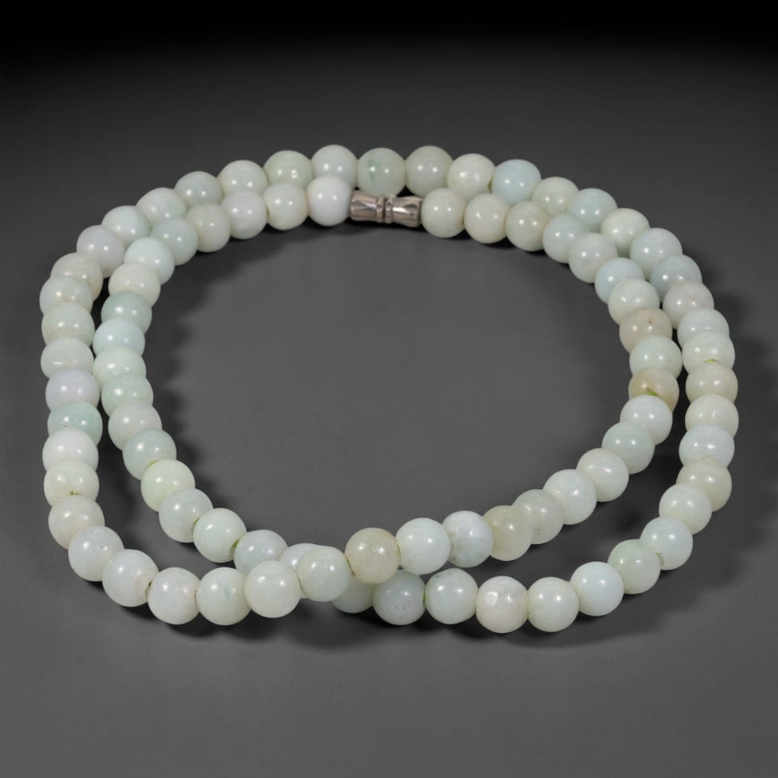 Natural Burmese Type A Pure White Jadeite Jade Beaded Necklace, 5TF: Strung from untreated natural Burmese Type A jadeite jade spherical beads measuring 8.6mm in diameter, this full strand holds a uniform smooth polished finish presenting soft pure white stone bases bl