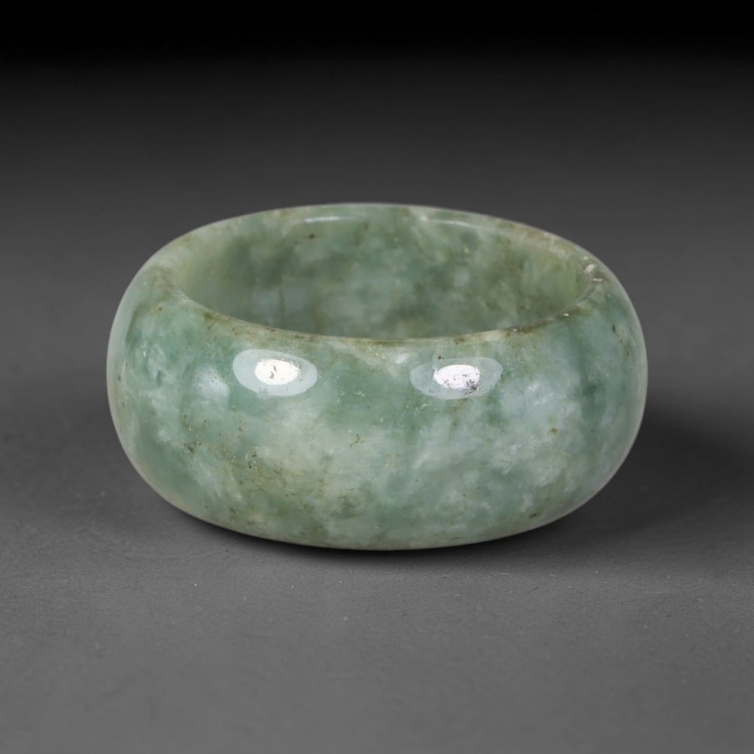 Natural Burmese Type A Jadeite Jade Band Ring Size US 9, 55TB: Crafted from untreated natural Burmese Type A jadeite jade, this solid stone band features a high-gloss polished finish displaying consistent deep green mineral tones interwoven with natural subtle to