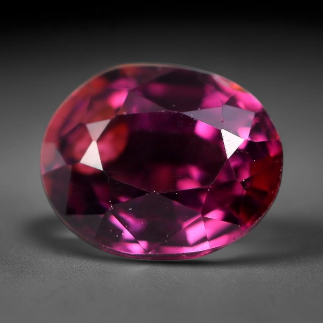 1.50 Carats Natural Deep Burgundy Red Garnet Oval Faceted Loose Gemstone, 60WS: This timeless oval faceted garnet boasts a luxuriously deep burgundy red tone that glows with vivid crimson fire across its precisely polished reflective facets. Fine natural micro mineral specks are 