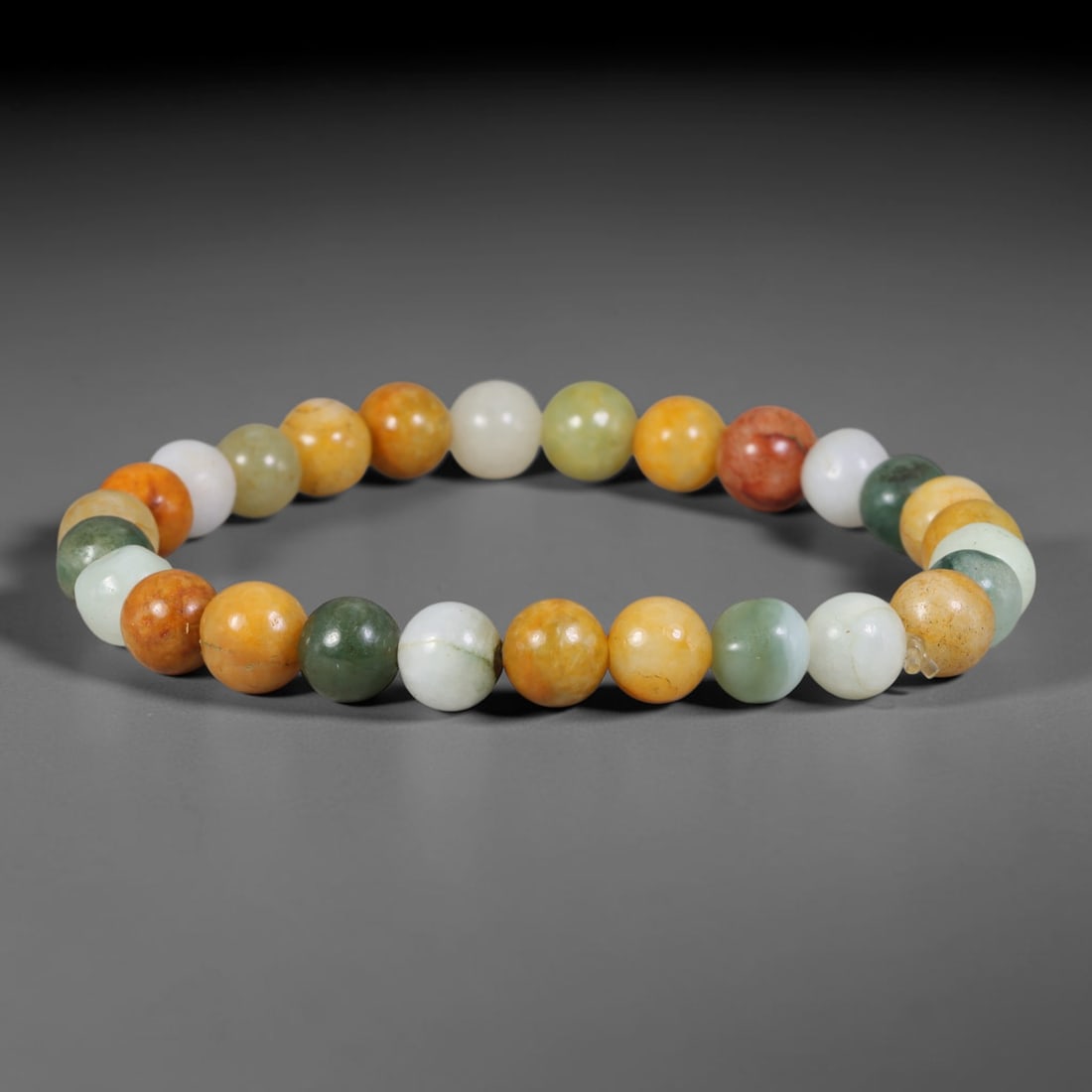 Natural Burmese Type A Multi-Colour Jadeite Jade Beaded Bracelet, 46TA: Strung from untreated natural Burmese Type A jadeite jade spherical beads with maximum bead dimension of 7.97mm, this bracelet strand features a sleek smooth polished finish showcasing mixed pale gree