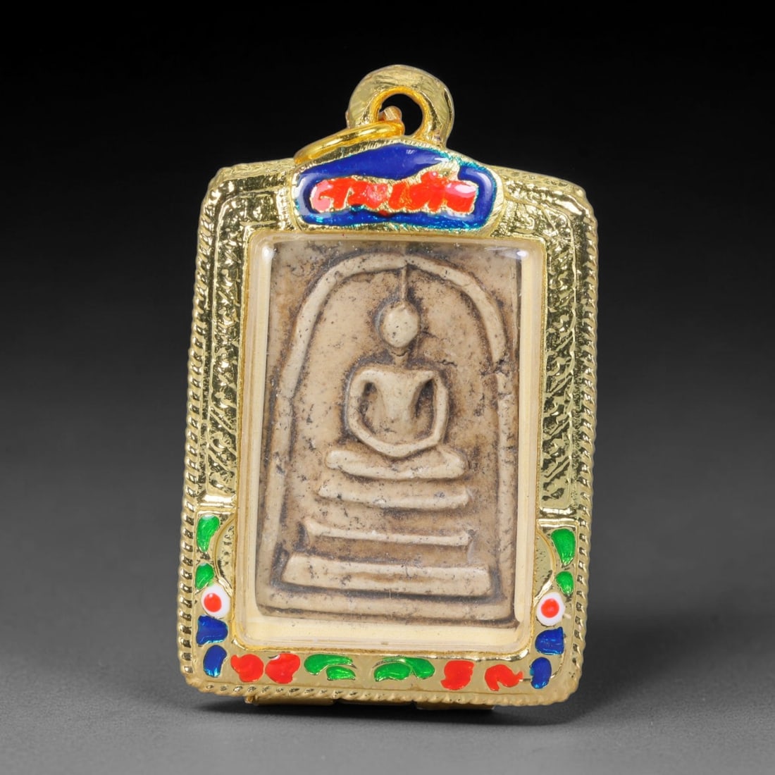 Thai Gilded Clay Metal Amulet Buddhist Votive Pendant, 49ZB: Constructed from fired clay with light gilded finishing layers, the piece uses traditional molded crafting techniques typical of Southeast Asian devotional artifacts. Its rectangular form follows stan