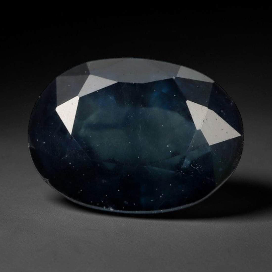 1.86ct Natural Madagascar Teal Navy Blue Sapphire Oval Loose Faceted Gemstone, LZ298: This natural oval faceted sapphire sourced from Madagascar weighs 1.86 carats with precise dimensions of 8.2x6.0x3.9mm. It features a moody deep teal-navy blue palette, with soft translucent grey-blue