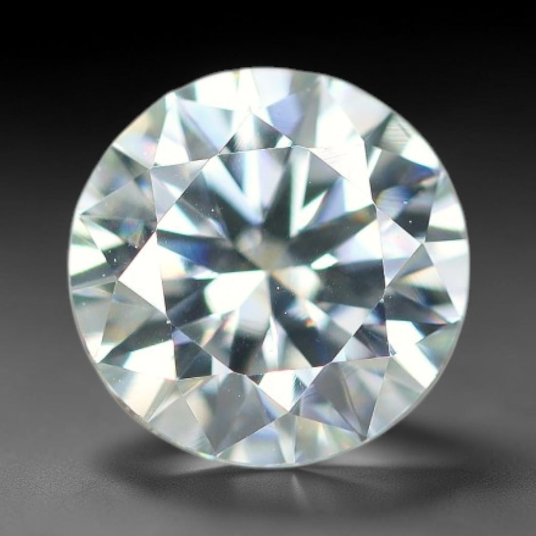 0.96 Carats Clear Moissanite Loose Gemstone, 33WP: This moissanite features dimensions of 6.4x3.9mm, a lab-created silicon carbide gemstone prized for its exceptional refractive index that generates brilliant light dispersion and consistent sparkle in