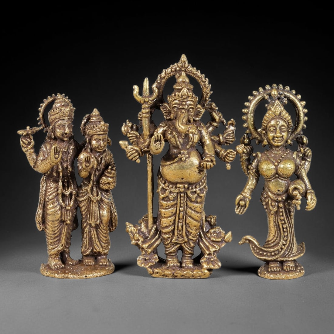 Thai Vintage Copper Alloy Hindu Sacred God Devotional Figures - 3pcs Set, 93YY: Mini vintage copper alloy deity statuette set of three pieces, each measuring 4.0x2.5cm. The set features intricately carved multi-armed Lord Ganesha holding trident, divine couple sculpture, and grac