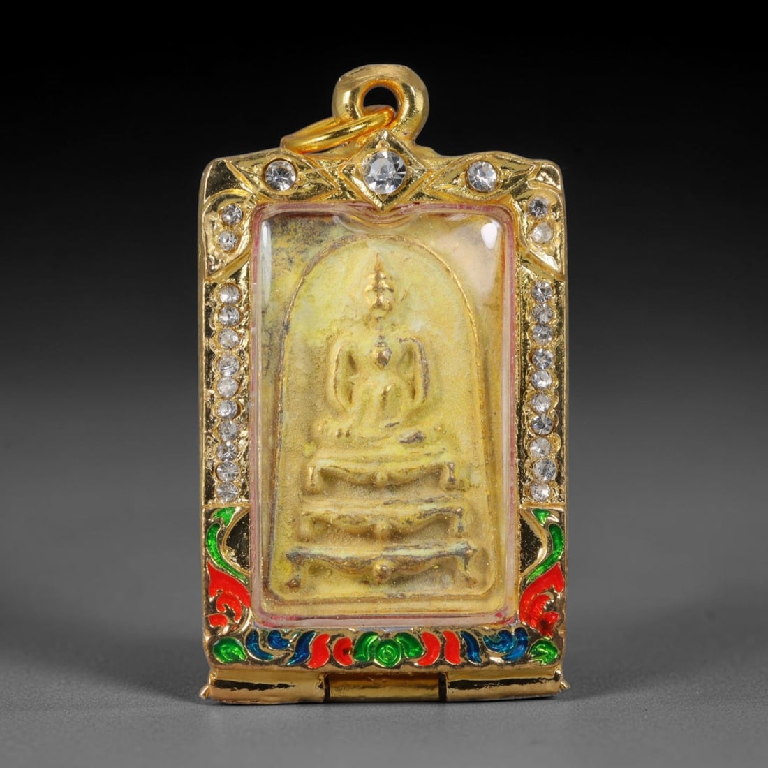 Thai Gilded Clay Metal Amulet Buddhist Votive Pendant, 47ZB: Constructed from fired clay with light gilded finishing layers, the piece uses traditional molded crafting techniques typical of Southeast Asian devotional artifacts. Its rectangular form follows stan