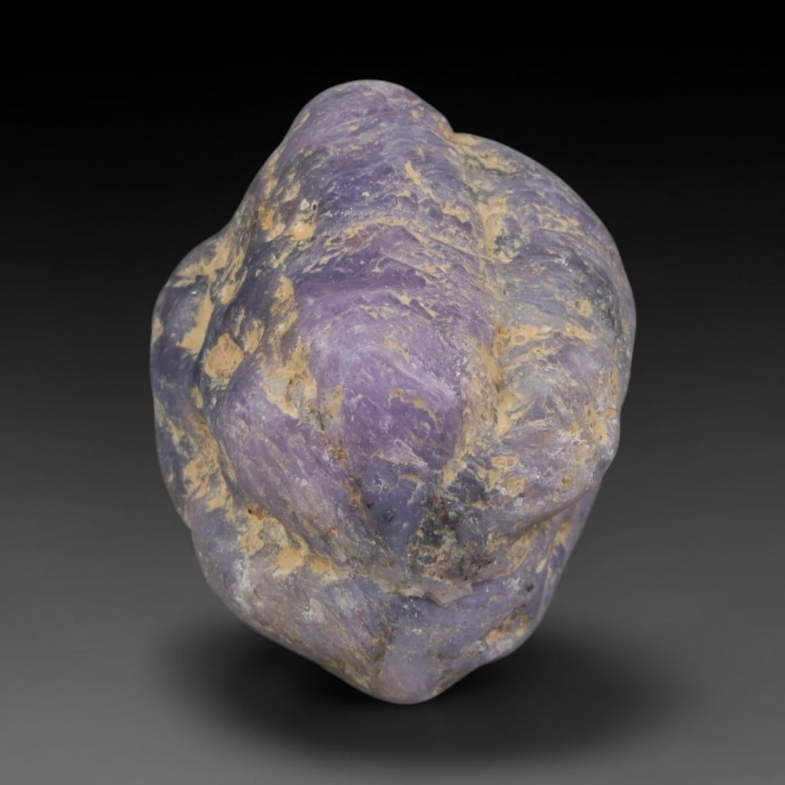 38ct Natural Unheated Sri Lankan Purplish Blue Sapphire Rough, 86YQ: This natural corundum rough is an unheated purplish blue sapphire sourced from Sri Lankan alluvial gem deposits, featuring an irregular natural native form with residual pale yellow-brown mineral matr