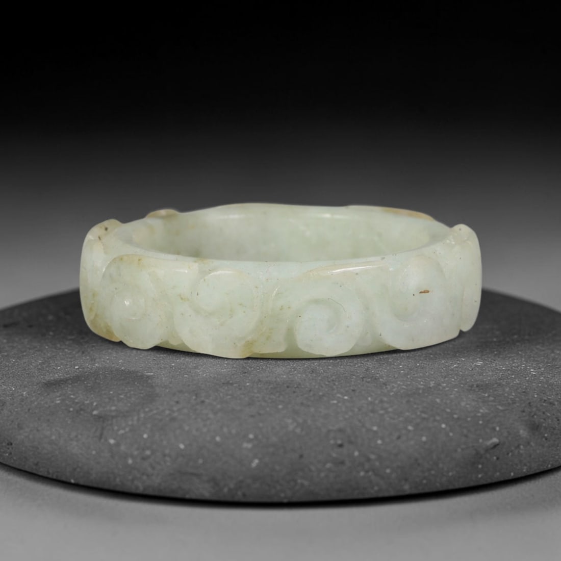Natural Burmese Type A Jadeite Jade Carving Band Ring Size US 11.5, 25TB: Carved from untreated natural Burmese Type A jadeite jade, this carved stone band holds a soft polished finish showcasing milky pale base hues interspersed with warm natural brown mineral patina patch