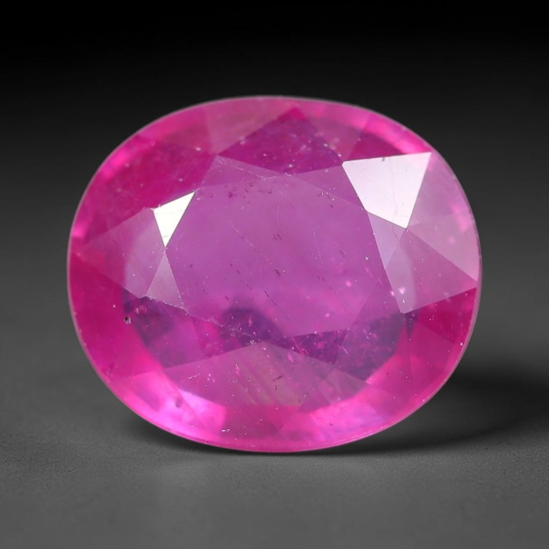 5.25 Carats Natural Mozambique Ruby Oval Faceted Loose Gemstone, 98WY: This natural Mozambique ruby is fashioned with standard oval brilliant faceting, displaying vivid saturated crimson-red hue accompanied by native fine mineral inclusions and subtle trace marks inheren