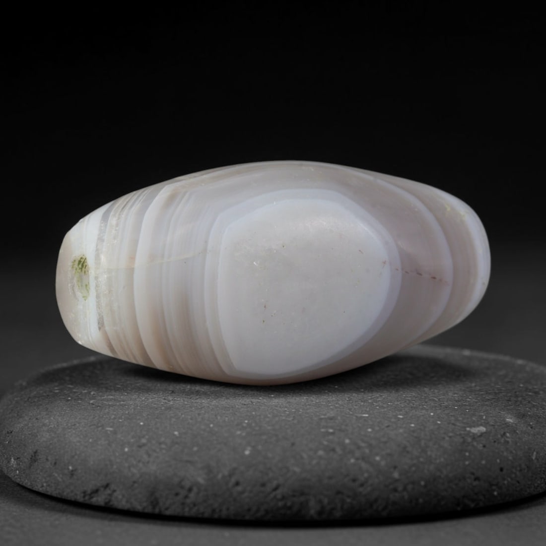 Ancient Sasanian Persian Empire Banded Agate Barrel Bead (224-651 CE), 55XD: This antique banded agate barrel bead originates from the Sasanian Persian Empire, a late antique West Asian culture renowned for refined agate talisman beads, carved seals, and elite jewelry traded a