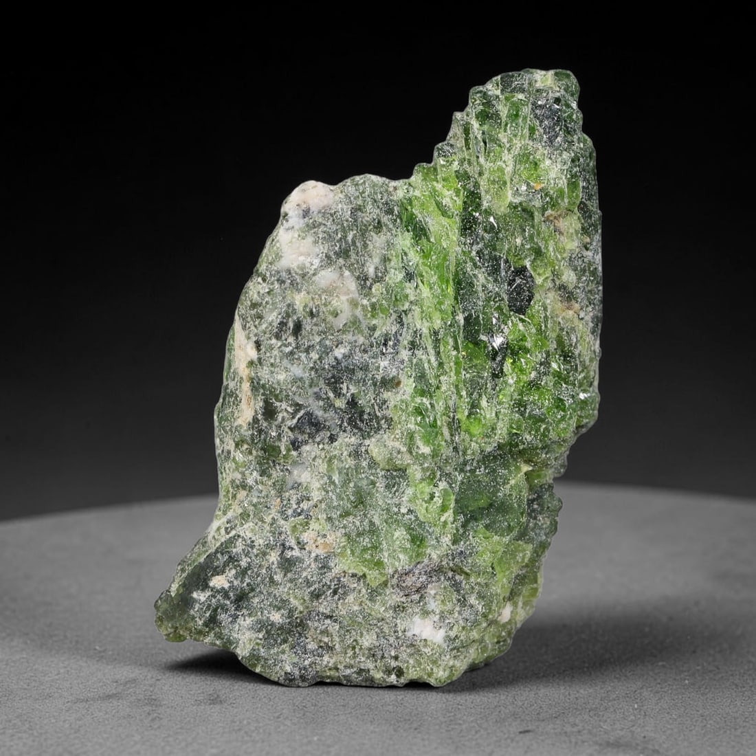 91 Carats Natural Vibrant Green Chrome Diopside Rough Specimen, 30YS: This is an untreated natural chrome diopside mineral specimen formed through natural geological processes, displaying rich green coloration caused by chromium content within its crystalline structure.
