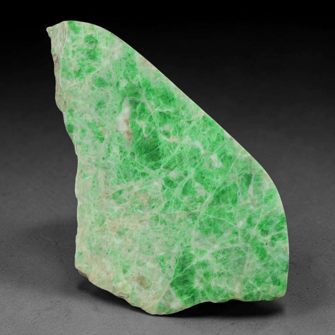 130ct Natural Type A Burmese Jadeite Jade Sliced Rough, 60YN: This specimen is a sliced rough block of natural Type A Burmese jadeite jade. The interior displays natural colour zoning with visible mineral veining and crystalline patterns typical of unprocessed j