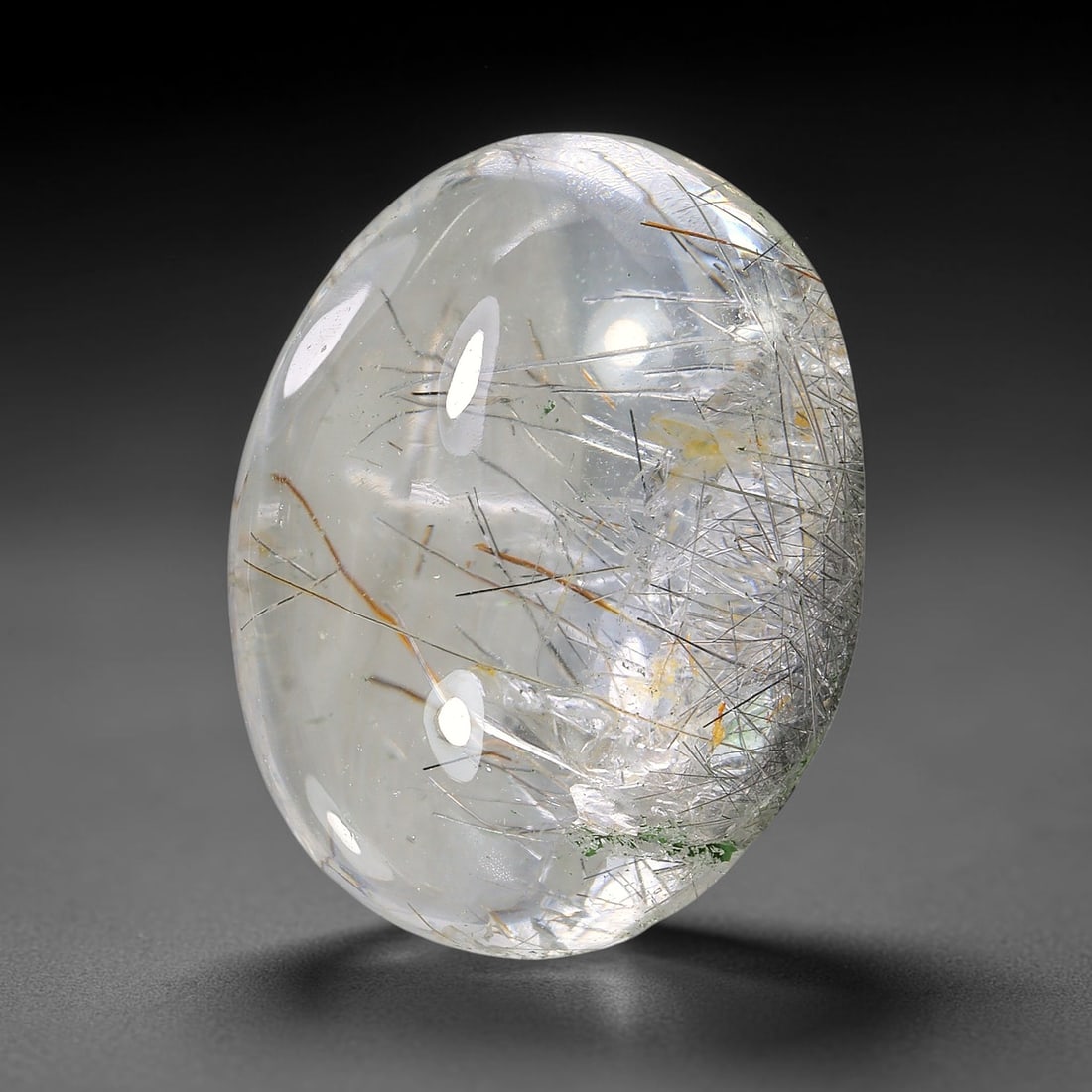 24.65ct Natural Brazilian Black Rutile Quartz Cabochon Loose Gemstone, 18YX: This polished cabochon of natural rutile quartz features countless distinct slender black rutile needle inclusions suspended within the clear quartz host crystal. The smooth domed surface enables full