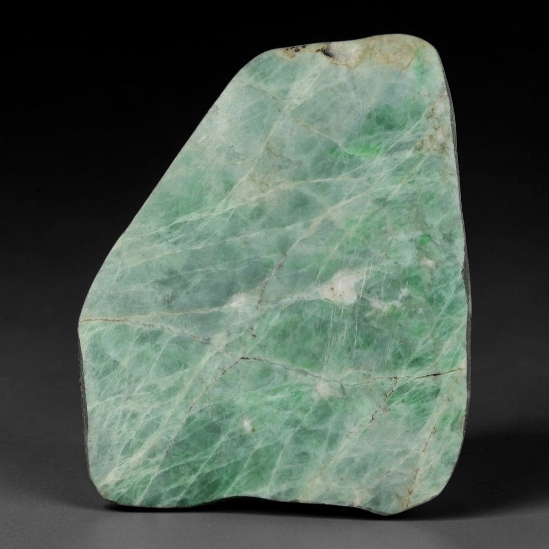 350ct Natural Type A Burmese Jadeite Jade Sliced Rough, 8YK: This specimen is a sliced rough block of natural Type A Burmese jadeite jade. The interior displays natural colour zoning with visible mineral veining and crystalline patterns typical of unprocessed j