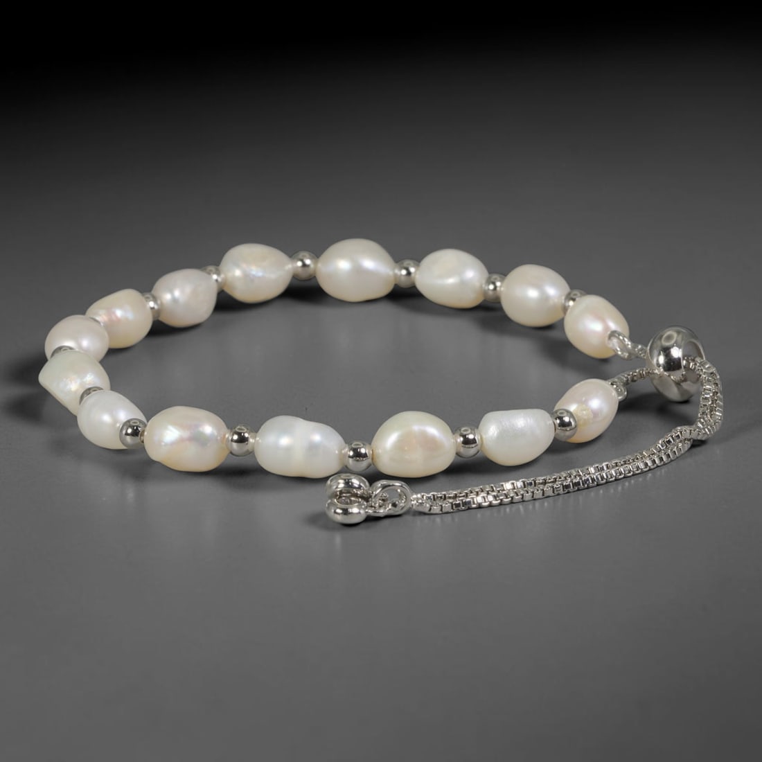 Natural Freshwater Pearl Bracelet - Baroque Pale White Pearl Strand, 99YM: Constructed from organic baroque natural freshwater pearls with soft pale white iridescent finish, each bead holding asymmetrical organic contours characteristic of naturally formed freshwater pearls.
