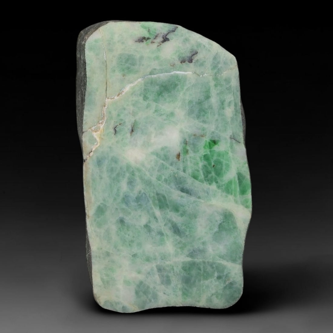 189ct Natural Type A Burmese Jadeite Jade Sliced Rough, 5YN: This specimen is a sliced rough block of natural Type A Burmese jadeite jade. The interior displays natural colour zoning with visible mineral veining and crystalline patterns typical of unprocessed j