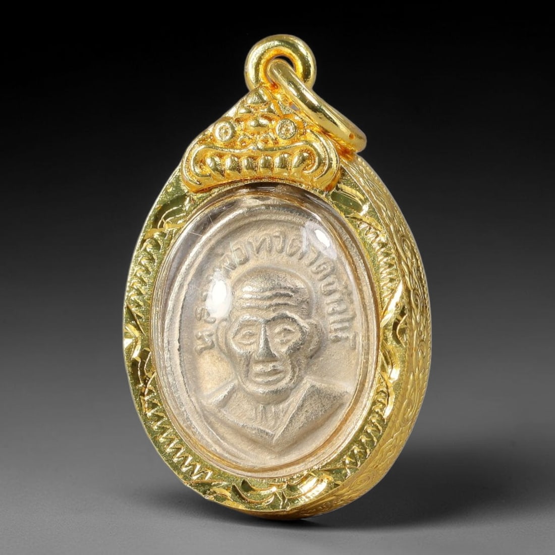 Thai Teardrop Dual-Sided Monk Amulet with Ornate Gold Plated Metal Casing Amulet, 50YY: Teardrop-shaped Thai revered monk medallion secured inside polished golden protective frame with clear transparent cover to shield the inner coin. This two-sided pendant displays distinct master monk 