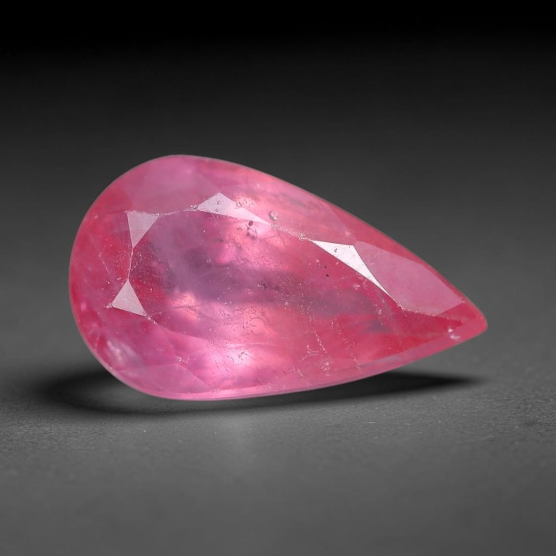 0.95 Carats Natural Orange Sapphire Pear Faceted Loose Gemstone, 97XM: This natural orange sapphire is fashioned in a classic pear brilliant faceted cut, presenting soft warm orange hues consistent with natural corundum specimens. Fine scattered mineral specks and faint 