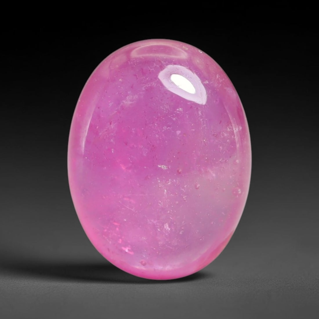 11.56 Carats Natural Mozambique Ruby Cabochon Loose Gemstone, 15XX: This ruby originates from Mozambique natural mineral deposits and receives professional cabochon grinding and polishing treatment to form a smooth glossy exterior surface. Tiny mineral particles and n