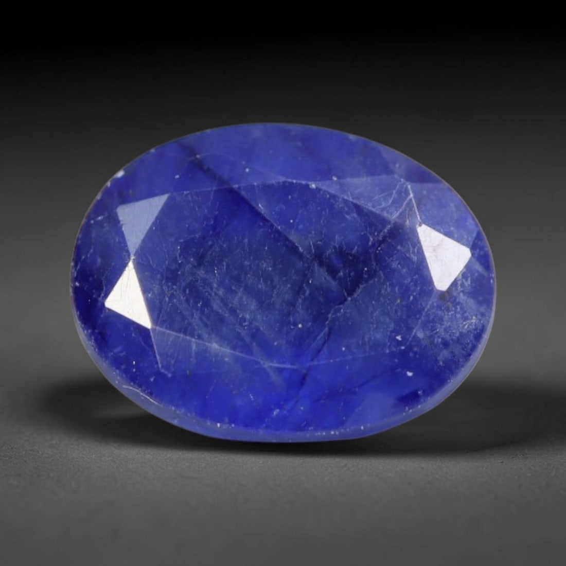 2.05 Carats Royal Blue Sapphire Oval Faceted Loose Gemstone, 39WS: This classic oval faceted sapphire displays rich saturated royal blue color glowing through crisp polished multi-facet cuts, featuring natural fine internal fissures and tiny scattered mineral micro s