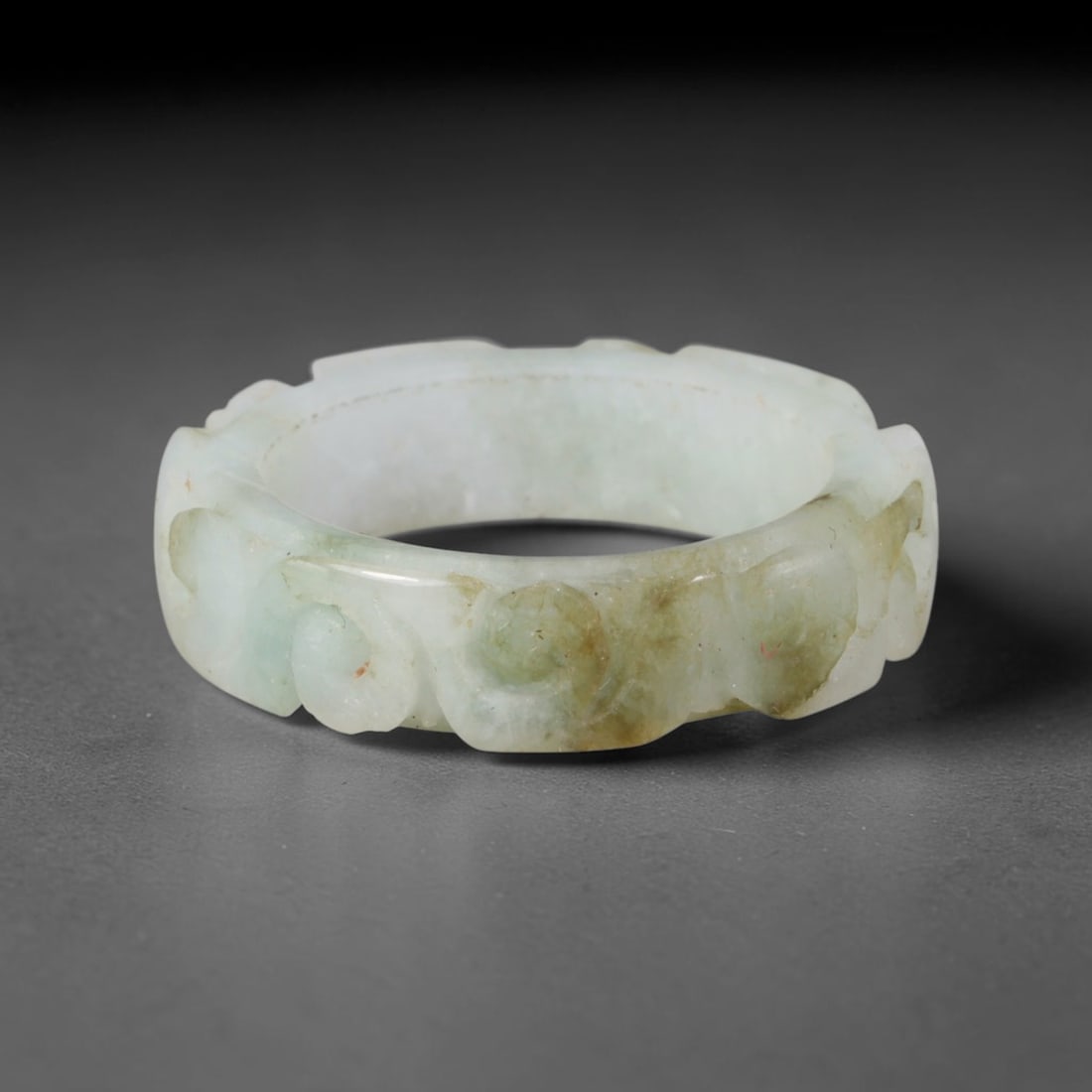 Natural Burmese Type A Jadeite Jade Carving Band Ring Size US 11.75, 19TB: Carved from untreated natural Burmese Type A jadeite jade, this carved stone band holds a soft polished finish showcasing milky pale base hues interspersed with warm natural brown mineral patina patch
