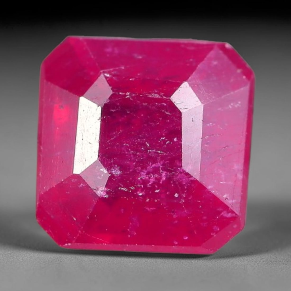 1.96 Carats Natural Madagascar Ruby Square Cushion Cut Loose Gemstone, 73XM: This natural Madagascar ruby is crafted into a square cushion modified step cut, displaying vivid saturated crimson red color typical of Malagasy corundum. Fine scattered mineral inclusions, subtle in
