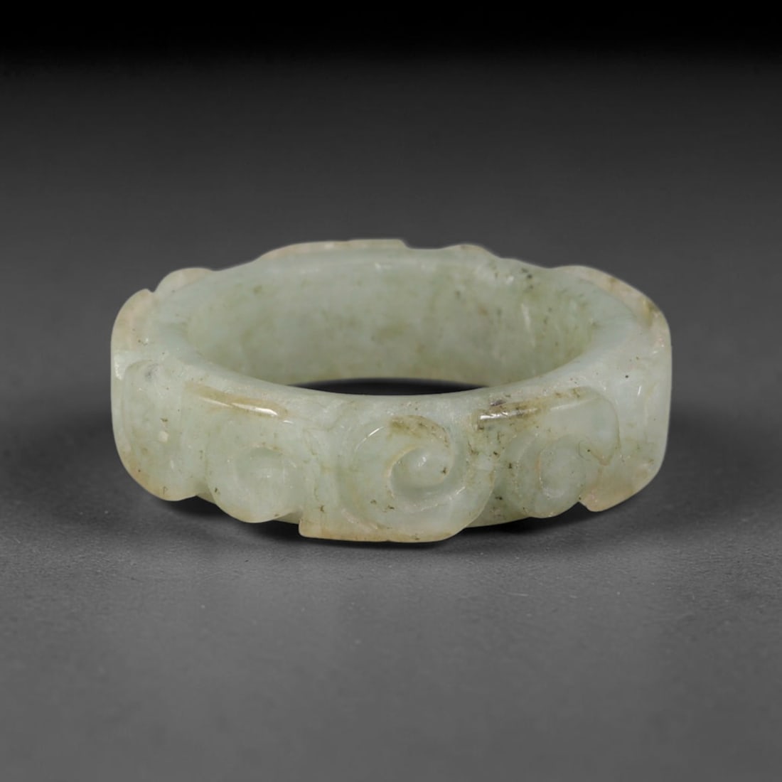 Natural Burmese Type A Jadeite Jade Carving Band Ring Size US 8.5, 12TB: Carved from untreated natural Burmese Type A jadeite jade, this carved stone band holds a soft polished finish showcasing milky pale base hues interspersed with warm natural brown mineral patina patch
