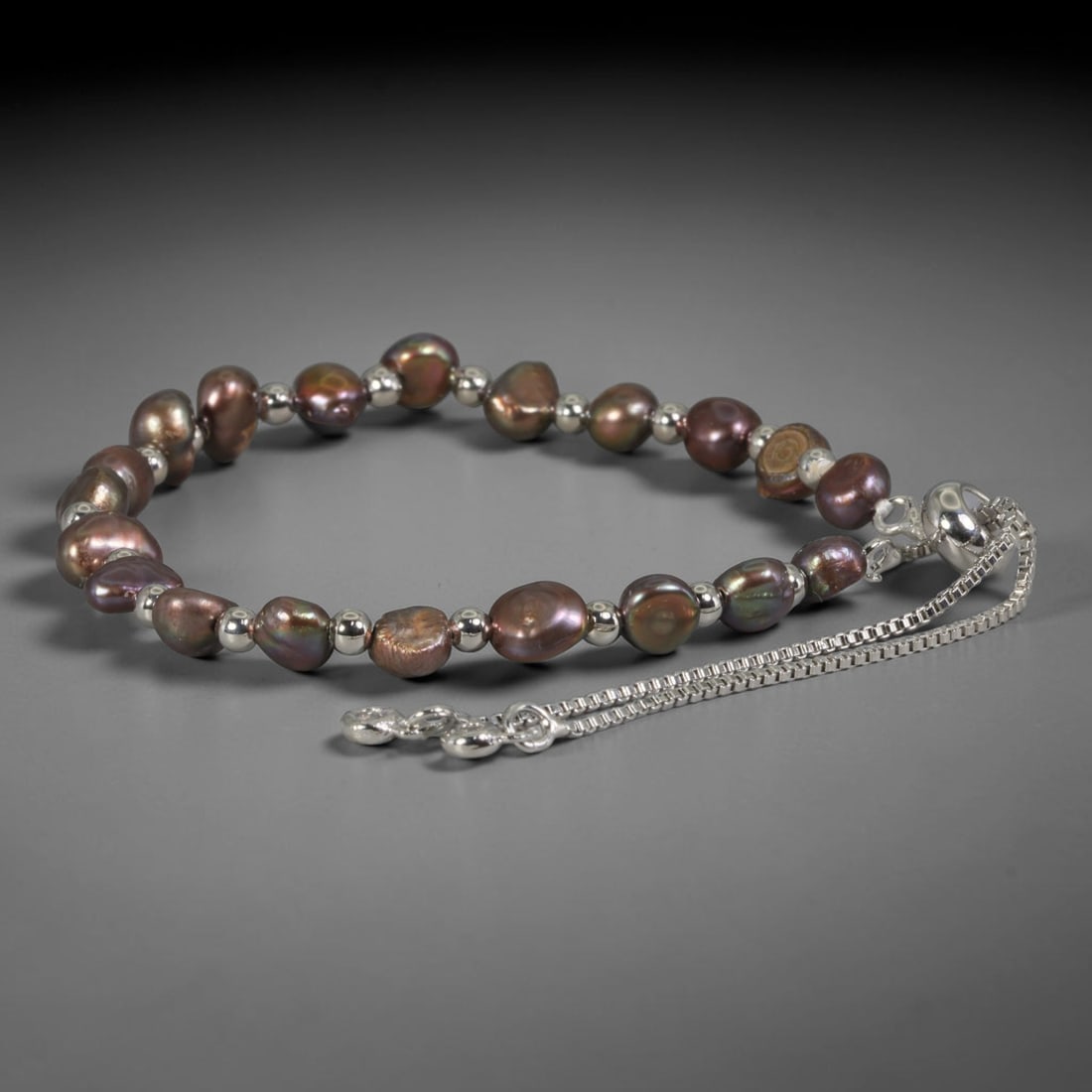 Natural Freshwater Pearl Bracelet - Baroque Bronze Pearl Strand, 100YM: Strung from organic baroque natural freshwater pearls displaying deep bronze iridescent luster with subtle multicolored overtones, each bead retaining uneven natural contours inherent to unrefined fre