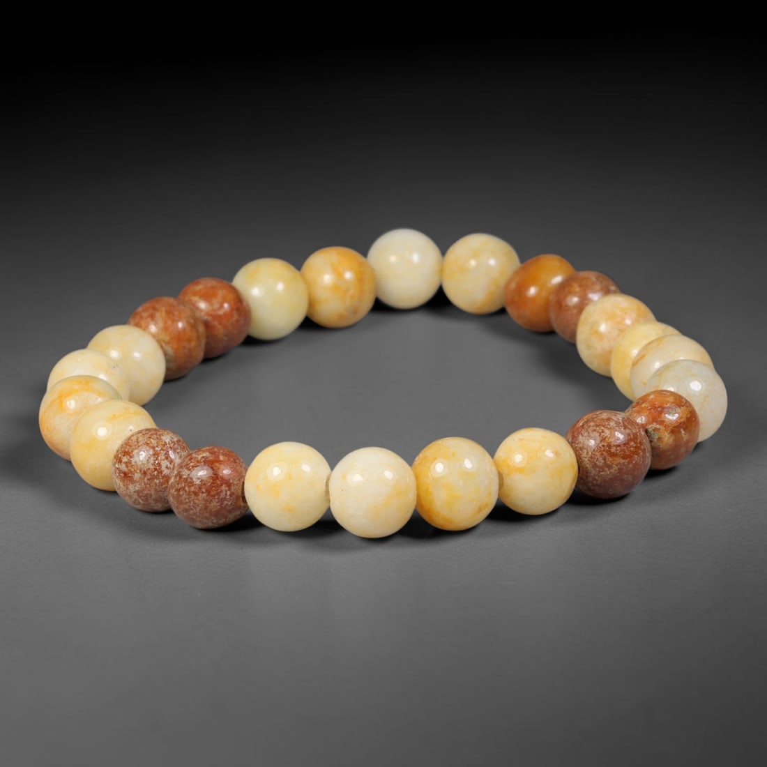 Natural Burmese Type A Mixed Russet Red & Golden Yellow Jadeite Beaded Bracelet, 76TA: Handcrafted from fully untreated natural Burmese Type A jadeite, this bracelet features small uniform round beads blended with two natural tones: creamy pale golden yellow base beads interspersed with