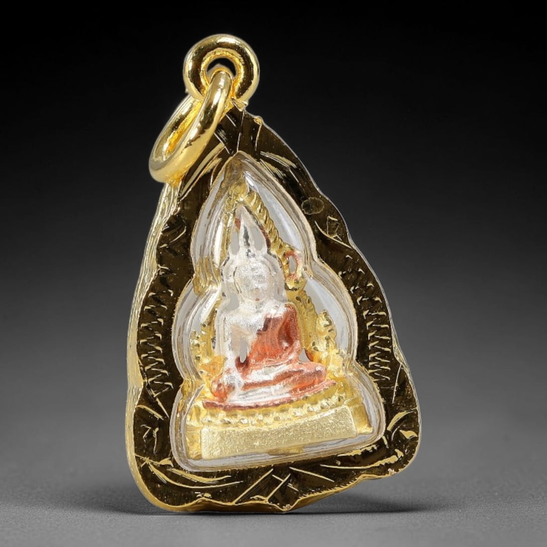 Mini Tri-Tone Seated Buddha Leaf Shaped Thai Amulet Gold Cased Pendant, 30YY: Compact palm leaf silhouette devotional pendant wrapped in finely hand-engraved polished gold casing with clear transparent protective cover and double loop gold hanging bail. Both sides feature ident
