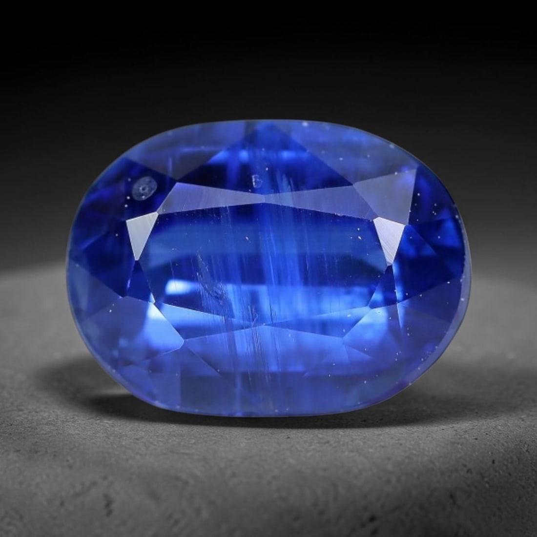 2.26 Carats Natural Brazilian Kyanite Oval Faceted Loose Gemstone, 62XY: This specimen consists of natural kyanite mineral material refined via professional faceted lapidary work, with uniform polished surfaces across the crystal exterior. Natural internal particulate mark