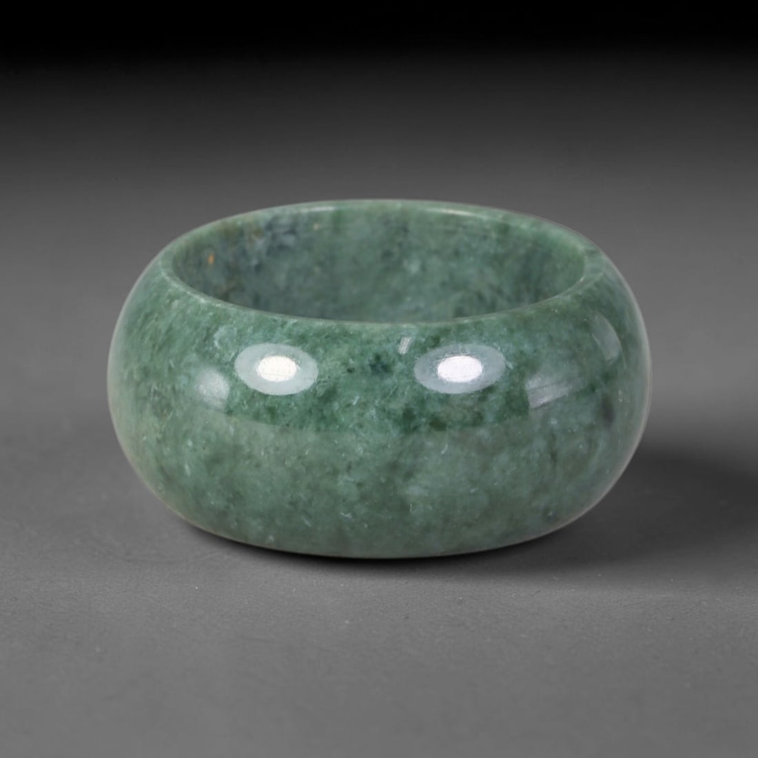 Natural Burmese Type A Jadeite Jade Band Ring Size US 9, 44TB: Crafted from untreated natural Burmese Type A jadeite jade, this solid stone band features a high-gloss polished finish displaying consistent deep green mineral tones interwoven with natural subtle to