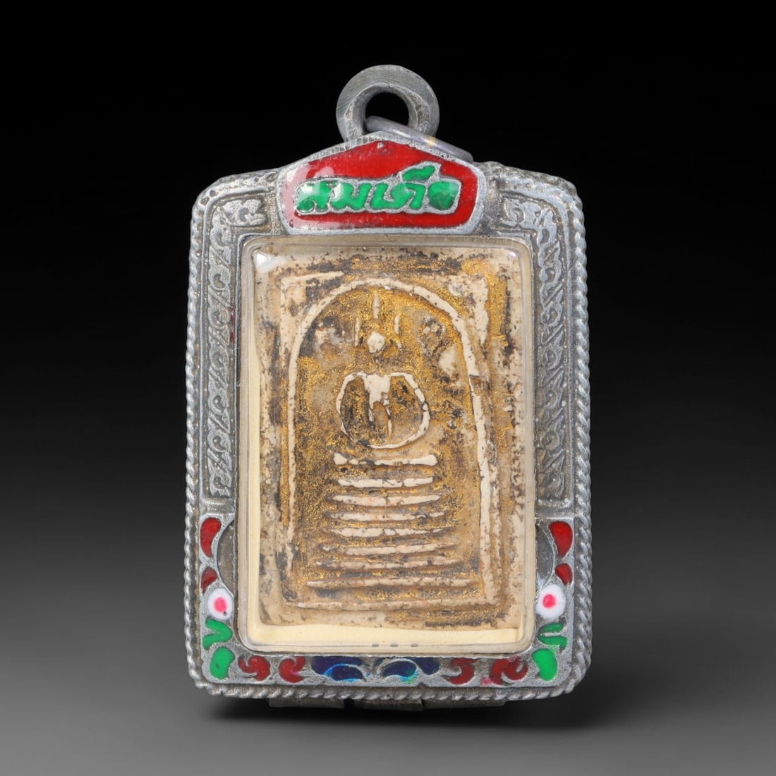 Thai Gilded Clay Metal Amulet Buddhist Votive Pendant, 32ZB: Formed from fired clay with applied gilded surface layers, the piece uses traditional molding techniques characteristic of Southeast Asian devotional craft. The construction adheres to standard region