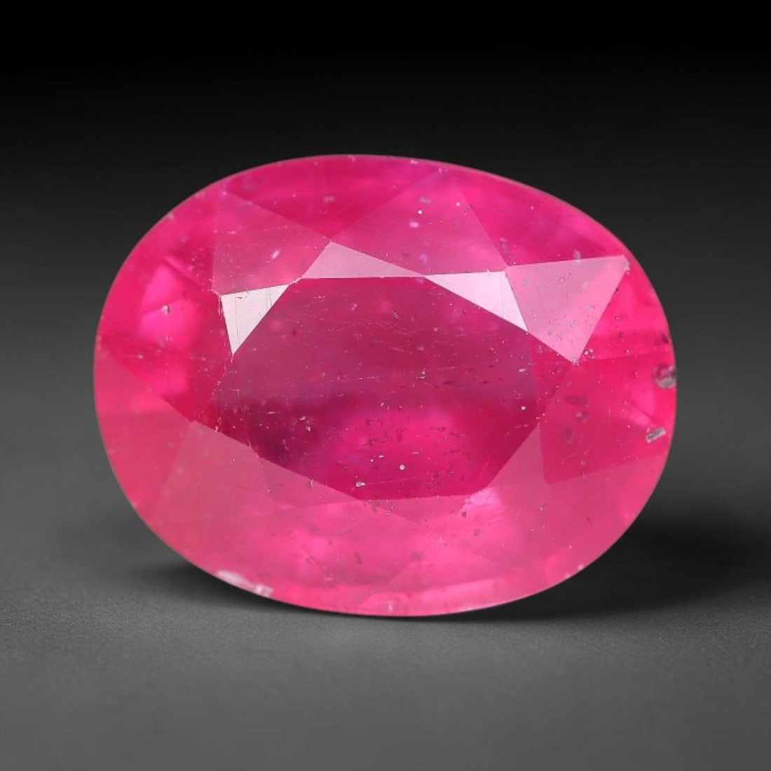 6.01 Carats Natural Mozambique Ruby Oval Faceted Loose Gemstone, 95WY: This natural Mozambique ruby is fashioned with standard oval brilliant faceting, displaying vivid saturated crimson-red hue accompanied by native fine mineral inclusions and subtle trace marks inheren