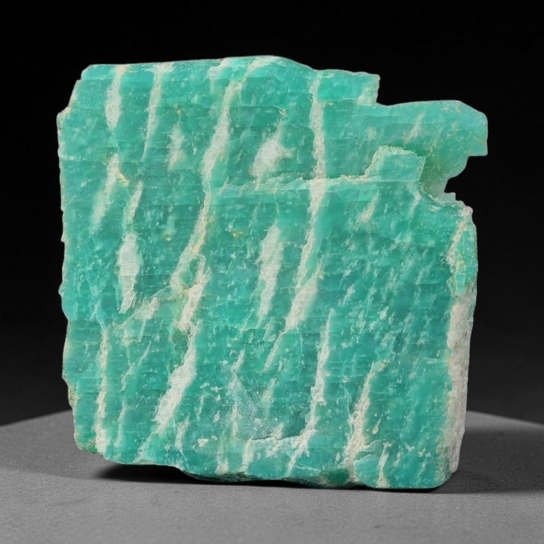 53ct Natural Russian Ural Amazonite Slab Rough, 45WV: This intact amazonite slab features distinct parallel mineral banding running uniformly across its naturally split flat surface within 30x28x8mm slab dimensions, retaining unmodified natural geologica