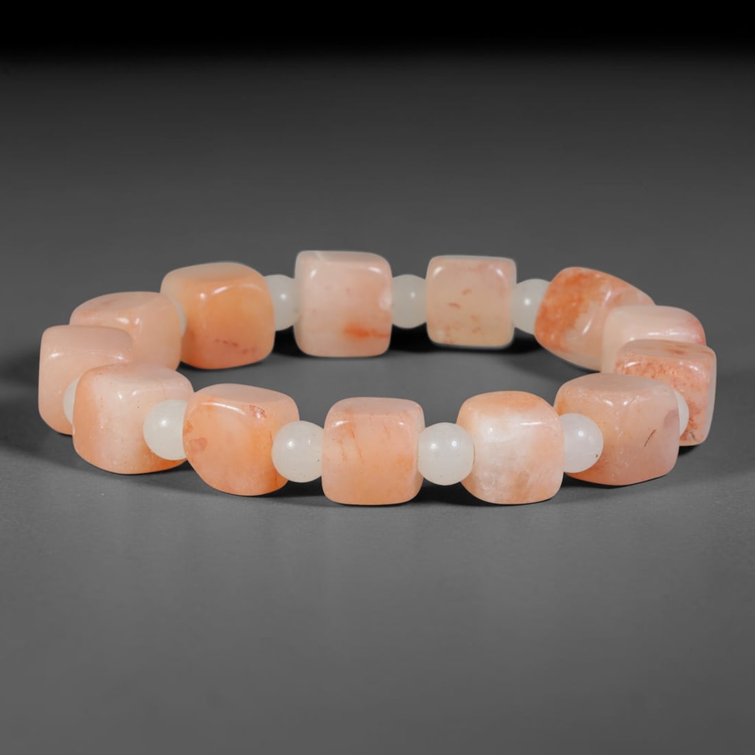 Natural Pink Peach Square Cube Jadeite Jade Beaded Bracelet, 23TA: Handcrafted from untreated natural Burmese Type A jadeite, featuring 10.9mm smooth rounded square cube beads in soft peach pink tone with natural orange-red mineral mottling and subtle internal veinin