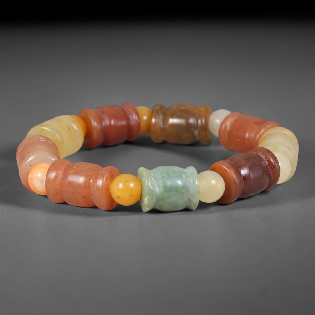 Natural Burmese Type A Multi-Tone Jadeite Jade Barrel Beaded Bracelet, 4TA: Crafted from untreated natural Burmese Type A jadeite jade beads with maximum bead dimension of 11.46mm, this wearable strand features a gentle polished finish displaying layered natural earthy minera