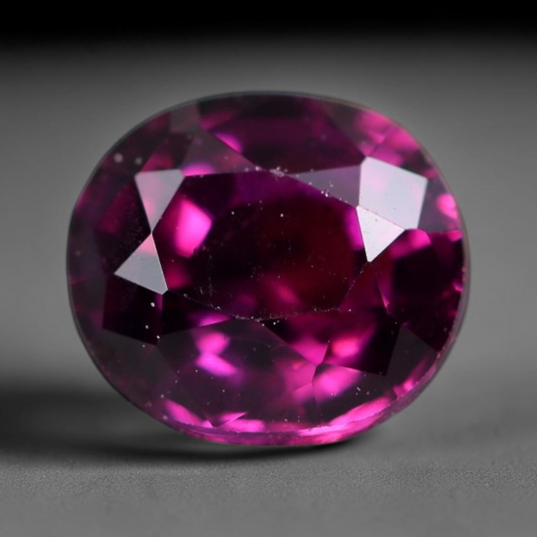 1.41 Carats Natural Deep Burgundy Red Garnet Oval Faceted Loose Gemstone, 59WS: This timeless oval faceted garnet boasts a luxuriously deep burgundy red tone that glows with vivid crimson fire across its precisely polished reflective facets. Fine natural micro mineral specks are 