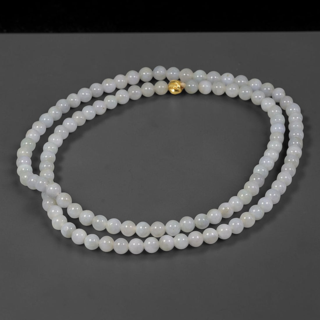 Natural Burmese Type A Pale Milky White Fine-Gauge Jadeite Jade Beaded Necklace, 24TF: Crafted from natural Burmese type-A jadeite, this delicate beaded necklace is composed of smoothly polished round beads measuring 5.5mm. The strand presents soft milky-white with faint cool undertones
